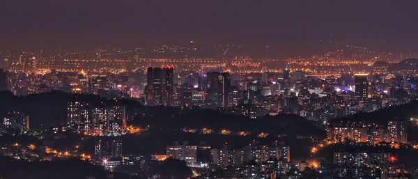 Illuminated cityscape at night