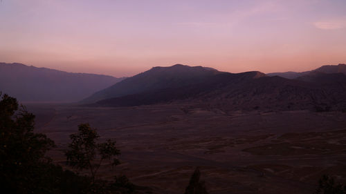 Scenic view of mountains against sky during sunset