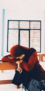 Young woman in hijab relaxing at home