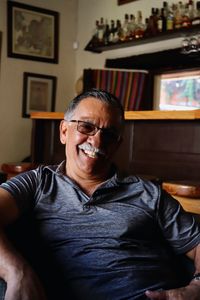 Portrait of smiling man sitting at home