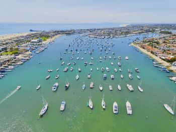 High angle view of boats moored in sea against sky