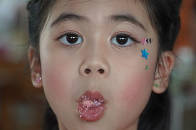 Close-up portrait of girl eating food