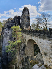 Low angle view of arch bridge against sky