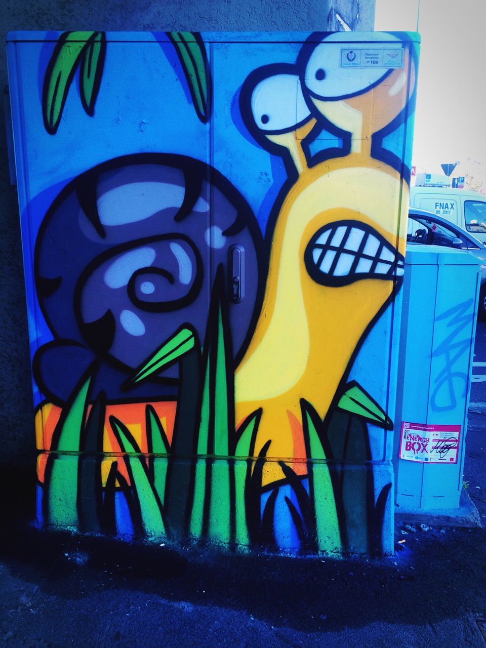 graffiti, creativity, art, art and craft, multi colored, text, yellow, blue, street art, western script, wall - building feature, human representation, communication, outdoors, day, animal representation, no people, wall, colorful, capital letter