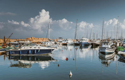 Boats moored at harbor