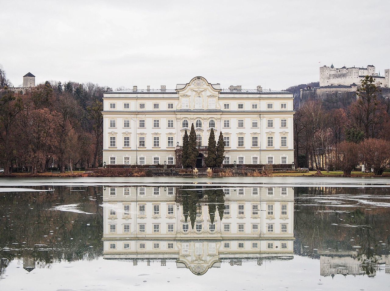 building exterior, reflection, architecture, built structure, city, water, travel destinations, facade, outdoors, sky, no people, day