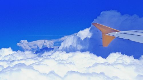 Aerial view of landscape against cloudy sky