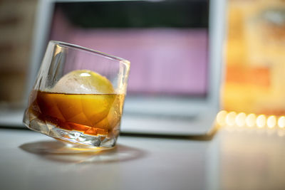 Close-up of beer glass on table