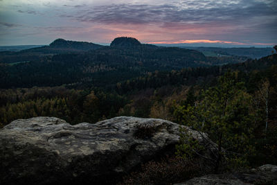 Scenic view of mountains against sky at sunset