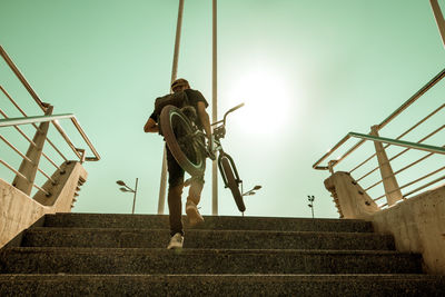 Low angle view of person walking on staircase