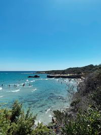 Scenic view of sea against clear blue sky