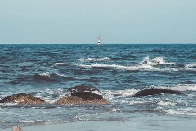 Scenic view of sea against clear sky