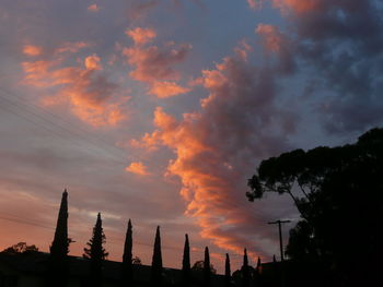 Low angle view of silhouette buildings against sky during sunset