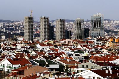 High angle view of city buildings against sky