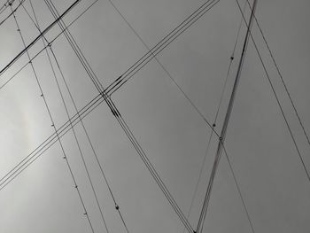 Low angle view of cables against sky