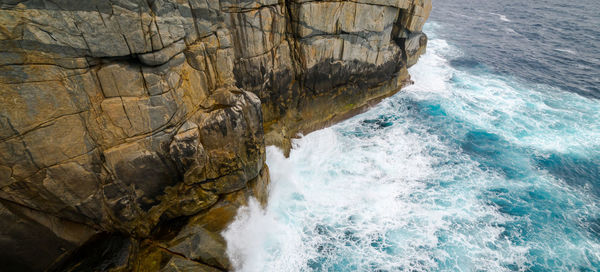 High angle view of rock formation in sea