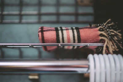 Close-up of blanket on shelf for sale at store