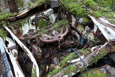 High angle view of old abandoned car on field