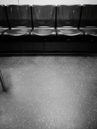 Close-up of empty chairs and table