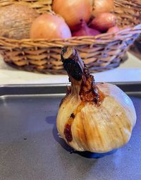 Close-up of pumpkins in basket on table