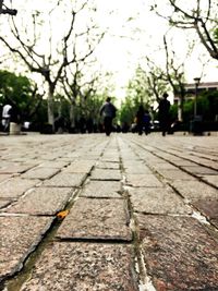 Blurred motion of people walking on road