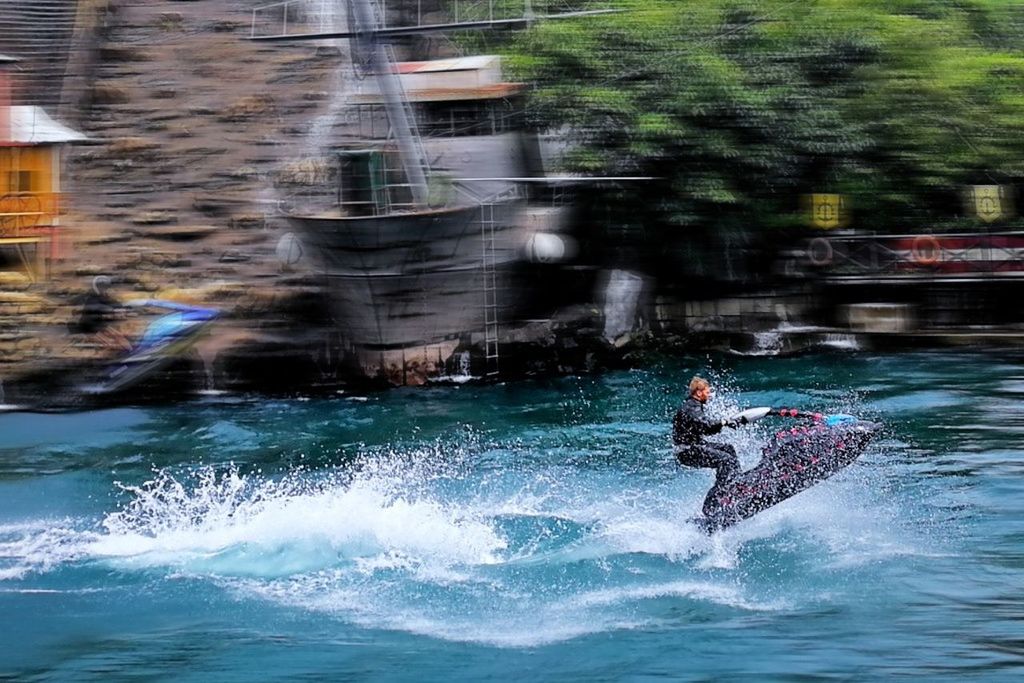 motion, sport, water, real people, aquatic sport, waterfront, speed, men, lifestyles, leisure activity, day, nautical vessel, sea, people, adventure, blurred motion, skill, extreme sports, surfing, outdoors