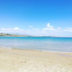 View of beach against blue sky