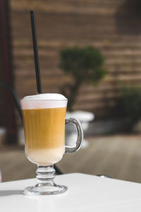 Close-up of coffee served on table at cafe