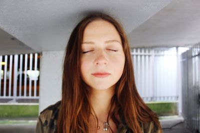 Close-up of young woman with eyes closed