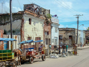 Bicycles on street against buildings in city