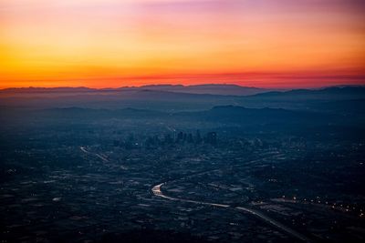 High angle view of city at sunset