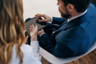 Midsection of woman using mobile phone