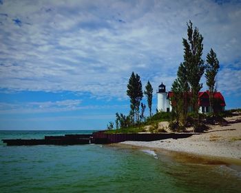 View of calm sea against cloudy sky