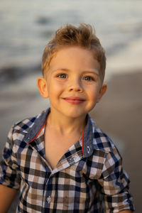 Close up portrait of toddler boy at the beach. summer vacation