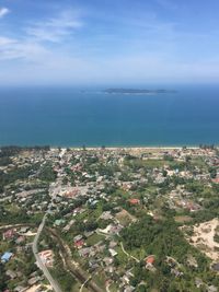 High angle view of sea and cityscape against sky