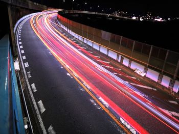 High angle view of light trails on road at night