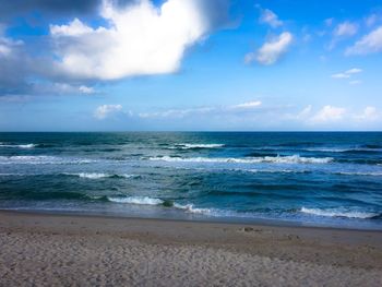 Scenic view of sea against cloudy sky