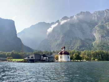 Scenic view of lake and mountains against sky