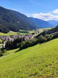 Scenic view of landscape and mountains against sky