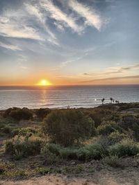 Scenic view of sea against sky during sunset