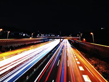 High angle view of light trails on highway at night