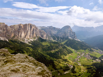 Scenic view of valley and mountains against sky