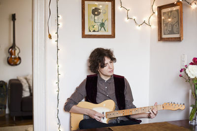 Young woman playing a guitar