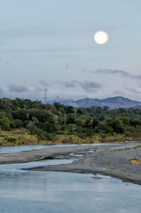 Scenic view of river against sky