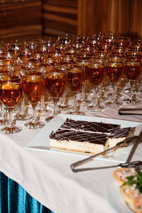 Close-up of wine glasses and food on table in restaurant