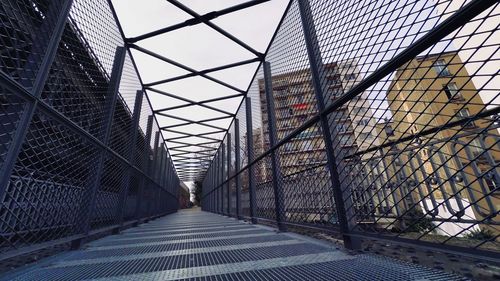 Metal fence against sky