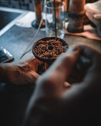 Midsection of man holding food at restaurant