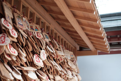 Close-up of clothes hanging on wood