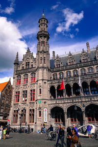 Low angle view of historical building against cloudy sky
