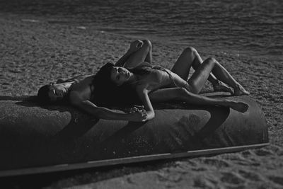 Woman lying on beach